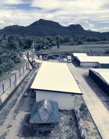 Accommodation building seen from above with mountains behind