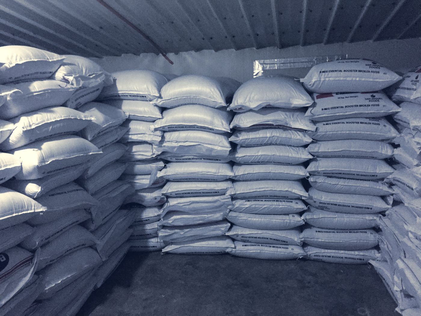 Stacked feed sacks in the storage room