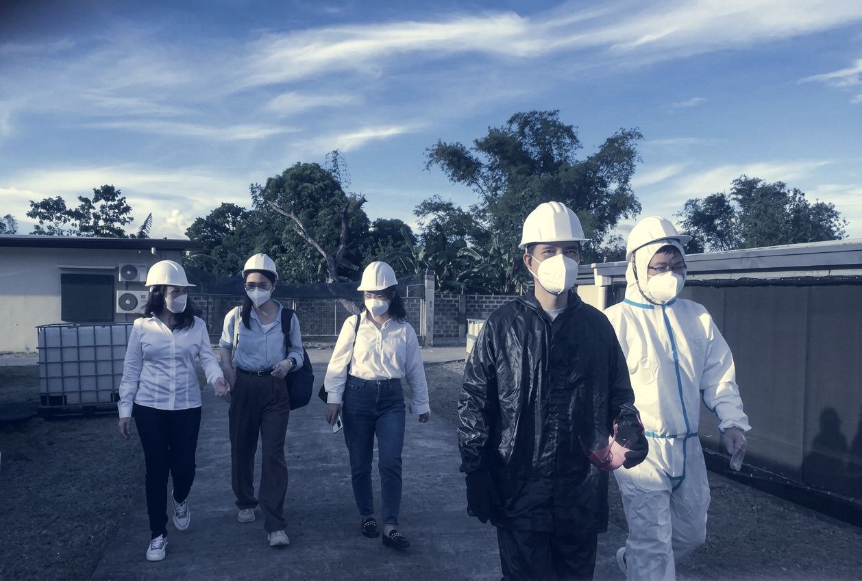 General manager and visitors walking through the site